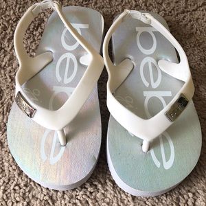 Size 9/10 white and silver Bebe flip flops